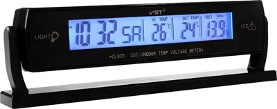 A black digital car clock with a blue display showing time, indoor and outdoor temperature, and voltage.