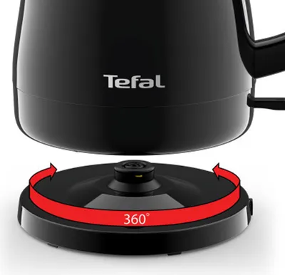 Close-up of the base of a black electric kettle, showing its 360-degree swivel base with a red arrow indicating rotation.