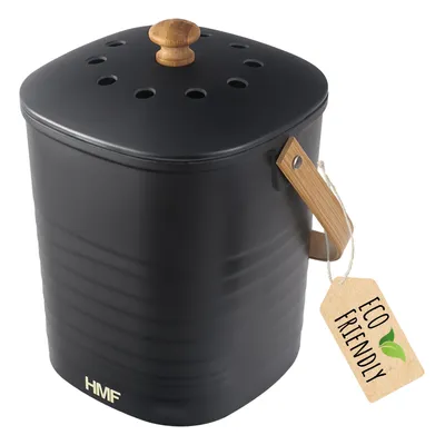 A black compost bin with a wooden lid knob and handle, with an 'Eco Friendly' tag attached.