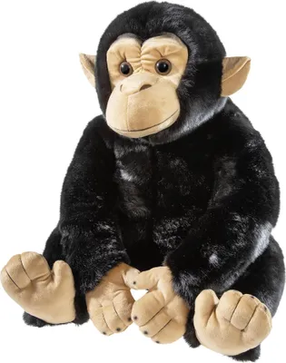 A plush chimpanzee toy sitting on a white background.