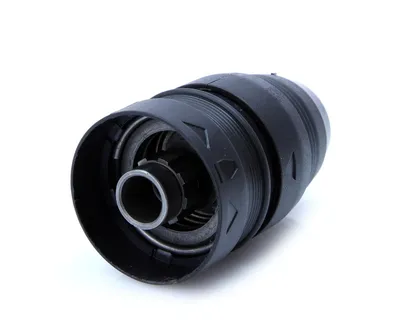 A black drill chuck with metal components is shown against a white background.