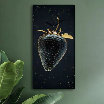 A rectangular clock with a black and gold strawberry design is hanging on a green wall, with large green leaves in the foreground.