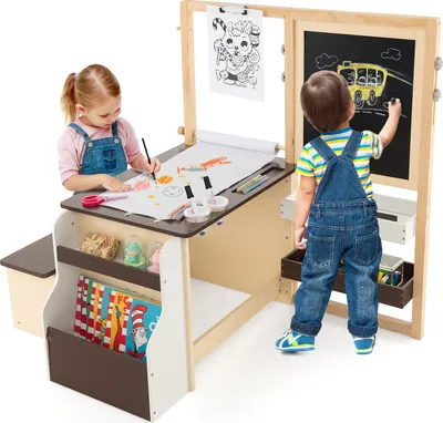 Two young children are actively engaged in drawing and writing at a multi-functional art easel set.