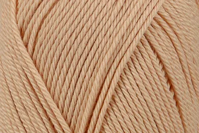 A close-up view of beige yarn.