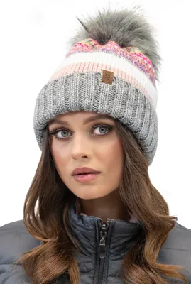 A woman wearing a winter hat and jacket.
