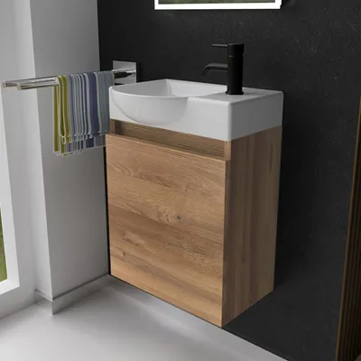 A modern bathroom vanity with a sink and faucet.