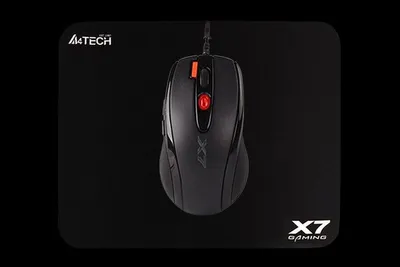 A black gaming mouse on a black mousepad.