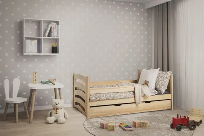 A child's bedroom with a bed, desk, and chair.