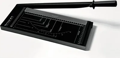 A black paper trimmer with a silver cutting guide and ruler markings is shown on a white background.
