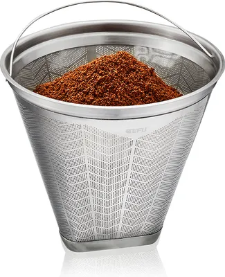 A stainless steel coffee filter filled with coffee grounds, shown against a white background.