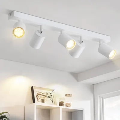 A white ceiling track light with five adjustable spotlights.
