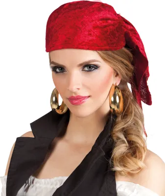 A woman wearing a pirate costume, including a red bandana and large gold hoop earrings.