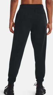 A person wearing black joggers, viewed from the back.