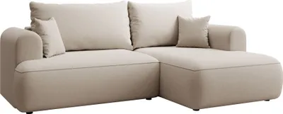 A cream-colored sectional sofa with throw pillows, shown from a front-side angle against a white background.