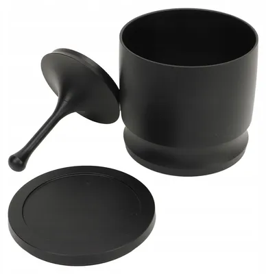 A black coffee powder collector and its lid are displayed on a white background.