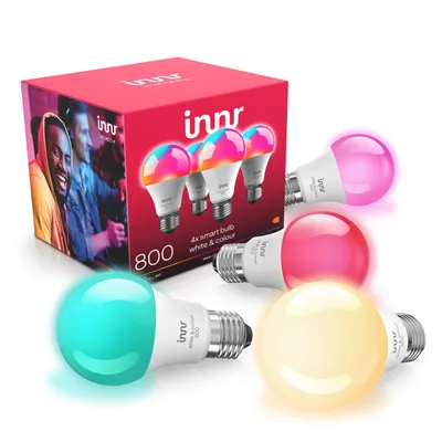 A product shot of a box of Innr smart bulbs with several bulbs displayed in front of it, some lit with different colors.
