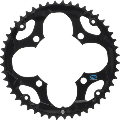 A black bicycle chainring with a decorative cut-out design.