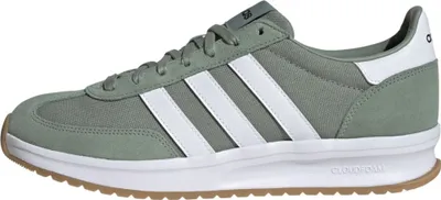 A side view of a single Adidas shoe.