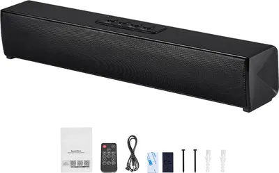 A black soundbar speaker with its accessories laid out below it on a white background.