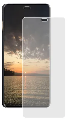 A screen protector is placed over a smartphone displaying a sunset over a body of water.