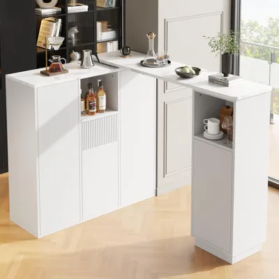 A modern white bar table with storage cabinets, set up in a contemporary room with a wooden floor and a large window.