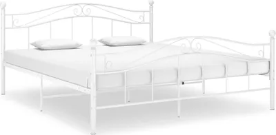 A white metal bed frame with two pillows on a mattress, shown from a side angle against a white background.