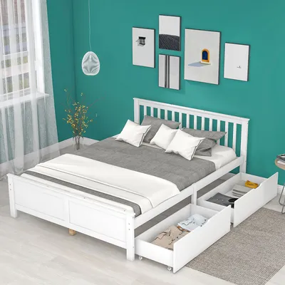 A white wooden bed frame with drawers is shown in a bedroom with teal walls.