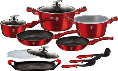 A collection of red cookware and kitchen utensils arranged on a white background.
