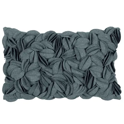 A rectangular pillow with a textured surface made of overlapping fabric petals.