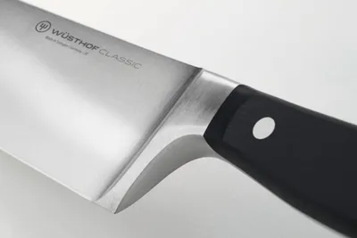 A close-up shot of a Wüsthof Classic vegetable knife.