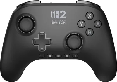 A black Nintendo Switch controller is shown from a front-facing, slightly angled perspective against a white background.