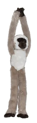 A stuffed toy monkey hanging by its arms.