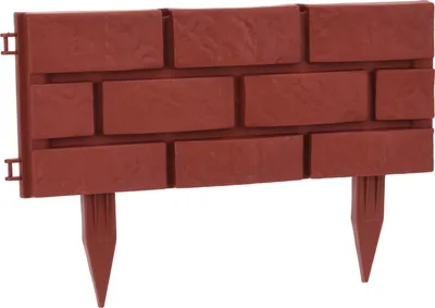 A single piece of garden edging with a brick pattern.