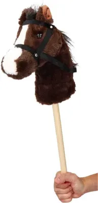 A hand holding a stick horse.