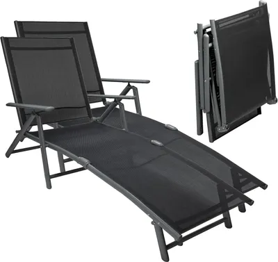 Two black foldable sun loungers are shown on a white background. One lounger is fully extended, and the other is folded.