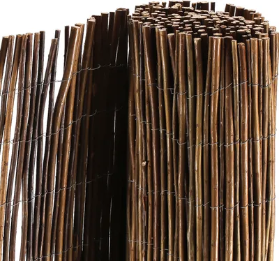 A close-up view of a rolled-up willow fence or screen, showing the texture and construction.