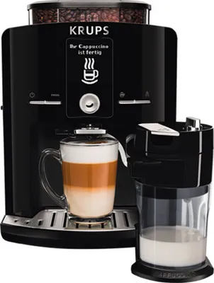 A black automatic coffee machine making a cappuccino.