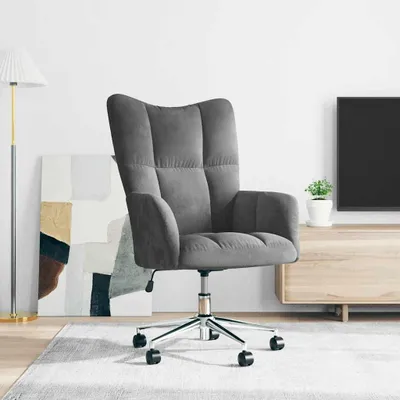 A dark gray velvet office chair is shown in a room with a floor lamp and a TV stand.