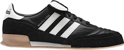 A side view of a black Adidas Mundial Goal soccer shoe.
