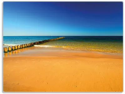 Produktbild von Wallario Glasunterlage, Schneidebrett aus Glas, Größe 30 x 40 cm, Motiv Sandstrand in orange - Blaues Meer - Blauer Himmel