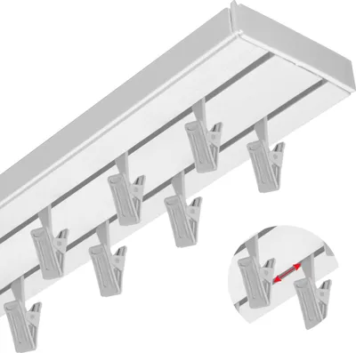 A close-up, angled view of a white ceiling track with multiple gray clips attached.