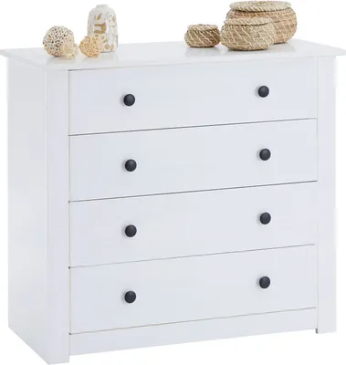 A white chest of drawers with black handles, decorated with small baskets and vases on top.