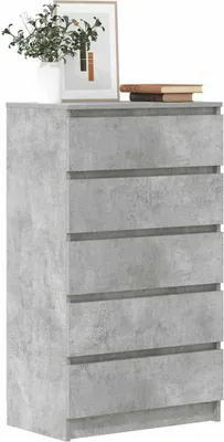 A chest of drawers with a concrete-like finish, decorated with a vase of plants and books on top.