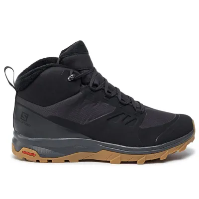 A black Salomon hiking boot with a brown sole is shown against a white background.