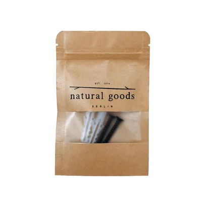 A brown paper pouch with a clear window showing screws and wall anchors inside.