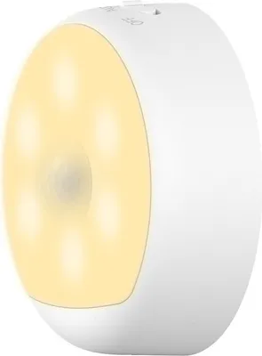 A white, round LED night light with a yellow illuminated front panel.