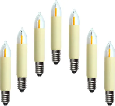 A group of seven LED filament candle bulbs arranged in a scattered pattern against a white background.