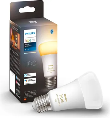 A Philips Hue LED light bulb and its packaging are displayed against a white background.