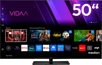 A smart TV screen displaying various streaming service logos and promotional content.