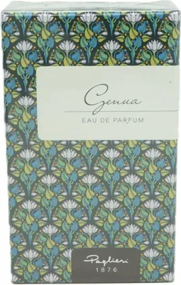 A close-up of a perfume box with a floral pattern.